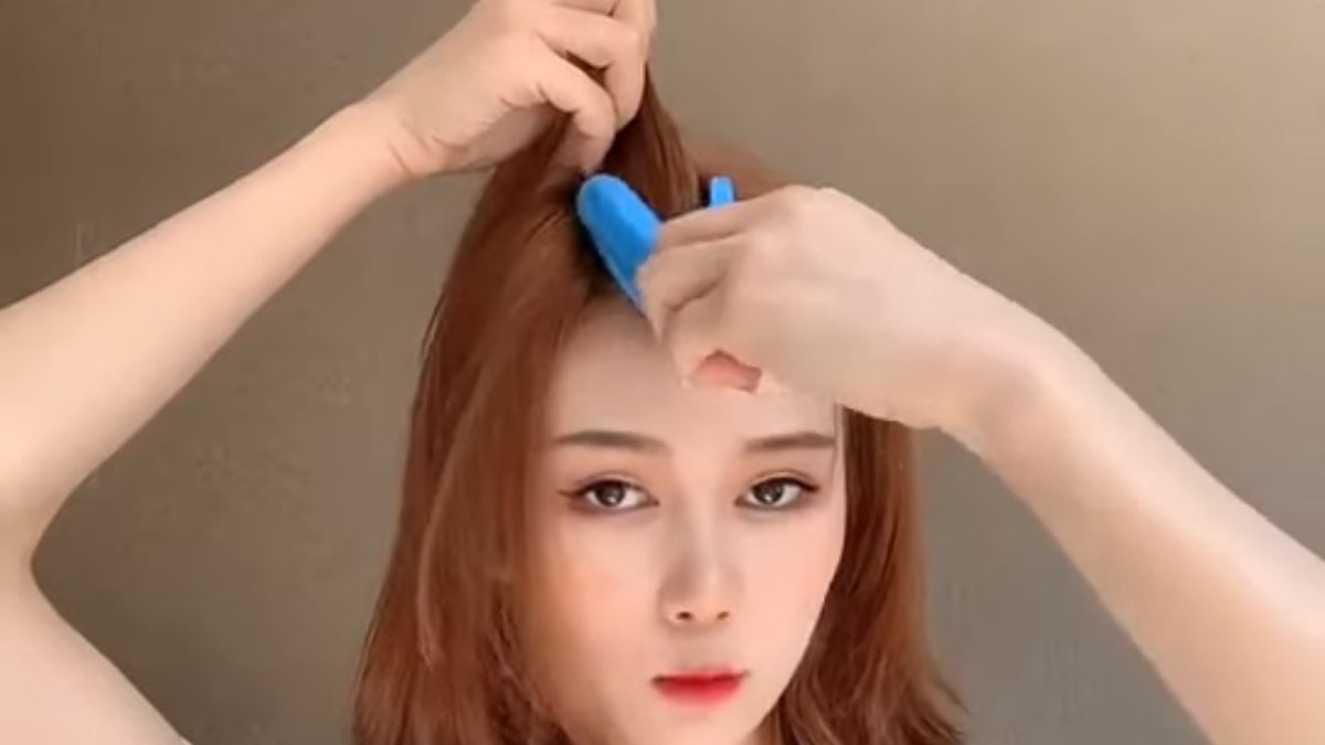 Cách uốn phồng chân tóc bằng kẹp tóc bước 1