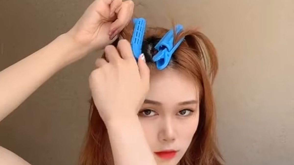 Cách uốn phồng chân tóc bằng kẹp tóc bước 2